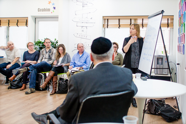 In the hot seat. Anat Geifman Broder debriefs the job interview simulation she just gave to Sinai in front of his fellow participants in Gvahim's Career Accelerator Program.